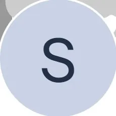 Light blue circle with a dark letter S in the center on a white background.